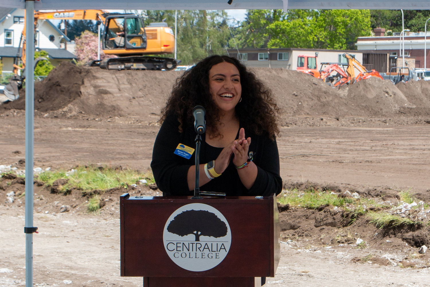 Marisol Vargas, student body president, gives a round of applause to those involved in the years of work to make the athletic field possible during the groundbreaking ceremony held Wednesday afternoon.